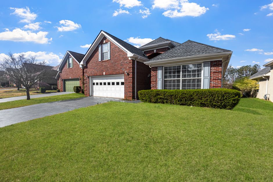 Green residential lawn with healthy grass after overseeding
